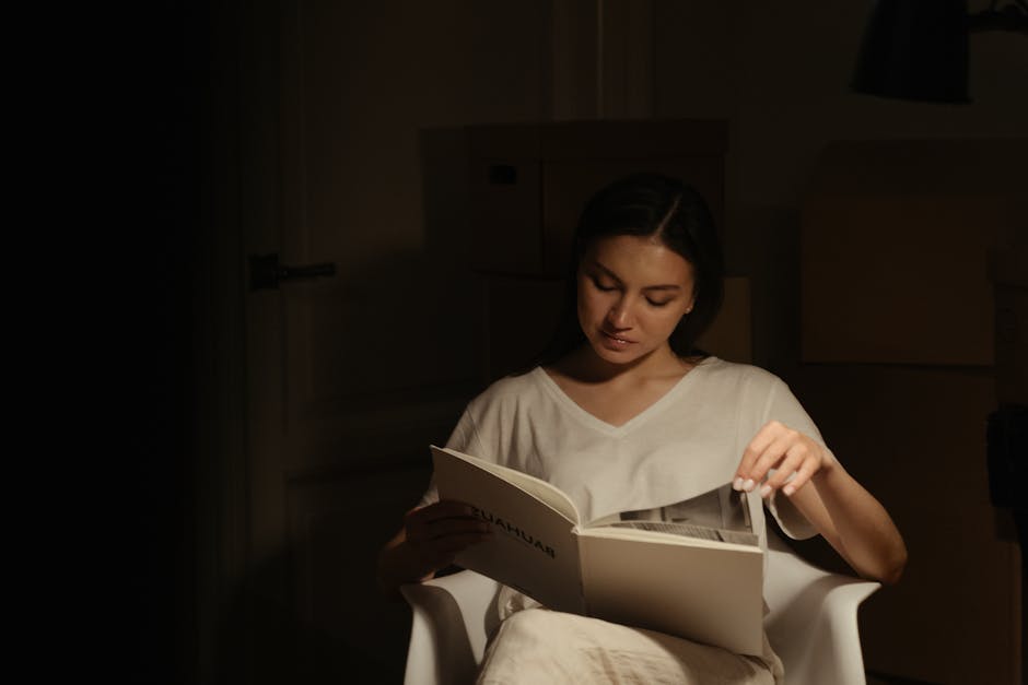 Woman peacefully stretching in a calm, dimly lit room in the evening.